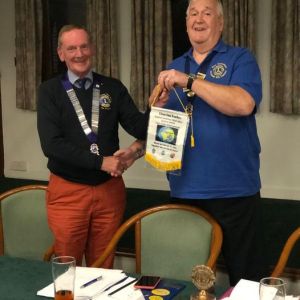 DG Ian Forbes presents his Bannerette to Liion President Ken Saunders