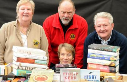 Lions members selling books at South Downs Garden Centre